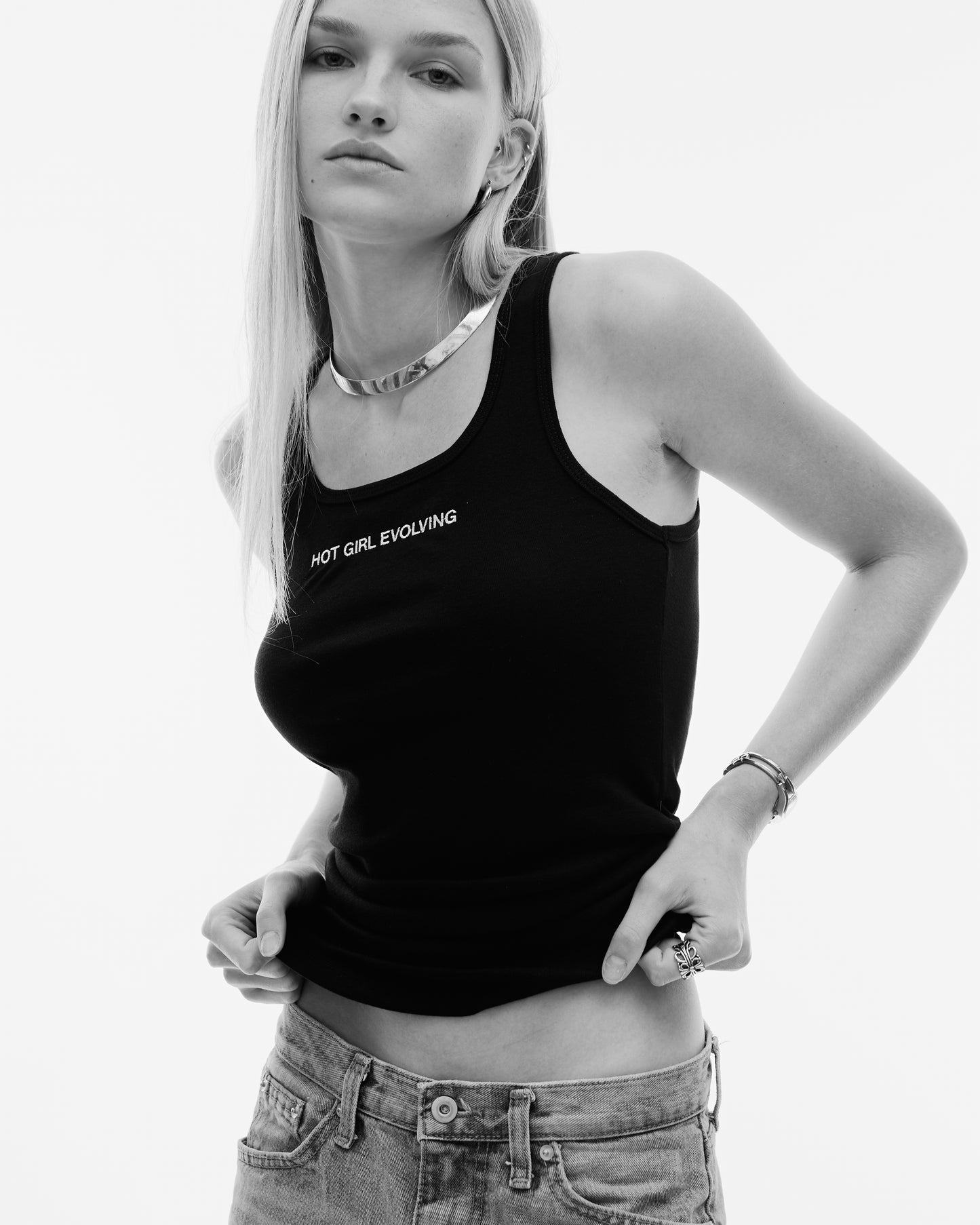 Calvin Klein style campaign with blonde model in a embroidered black tank top