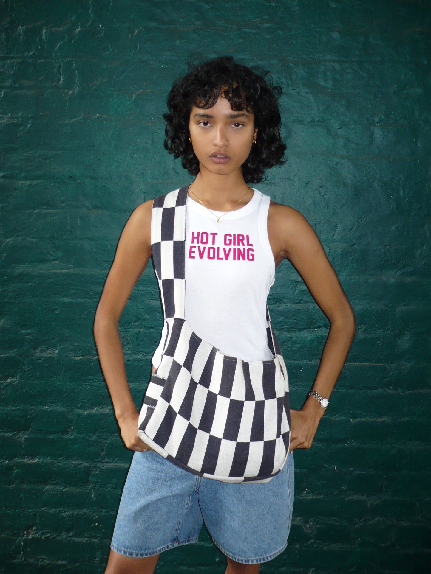 Model wearing trendy ribbed white tank top in London